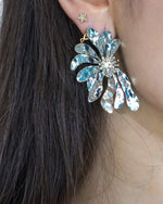 Aretes media flor